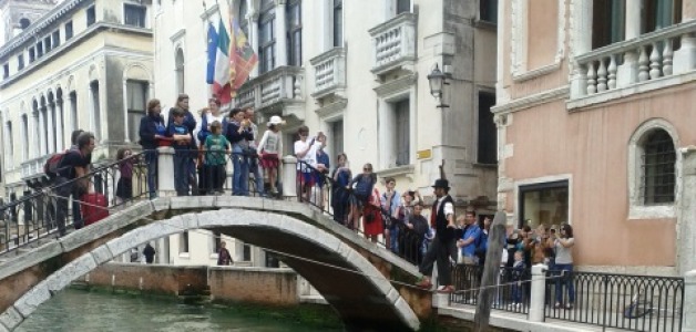 Venice Clown does Balancing Act over Canal
